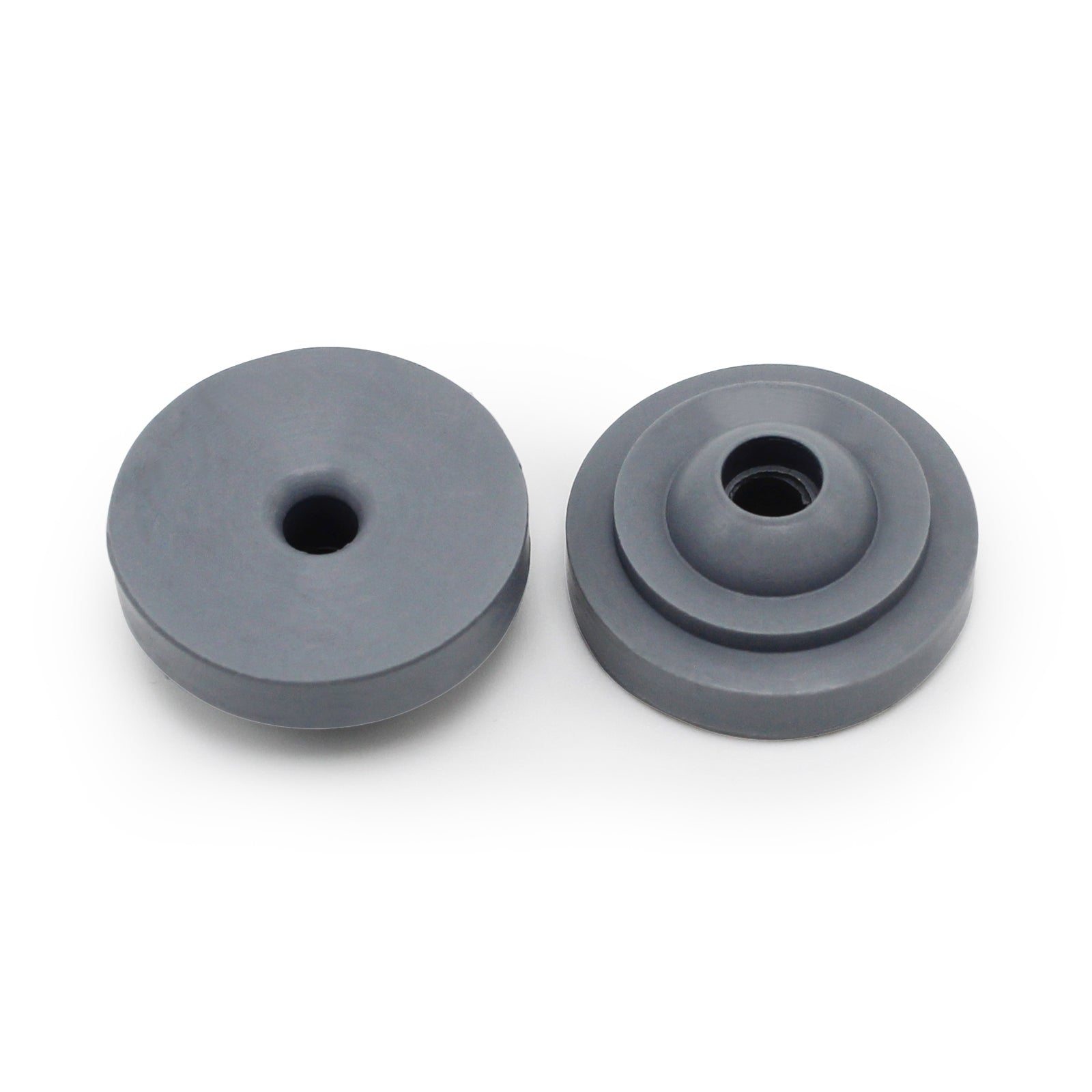 Two round, gray Prestaflator Big Presta Head Gaskets from Prestacycle—perfect Presta Head replacements—include one with a single hole and another with a stepped design, both displayed on a white background.