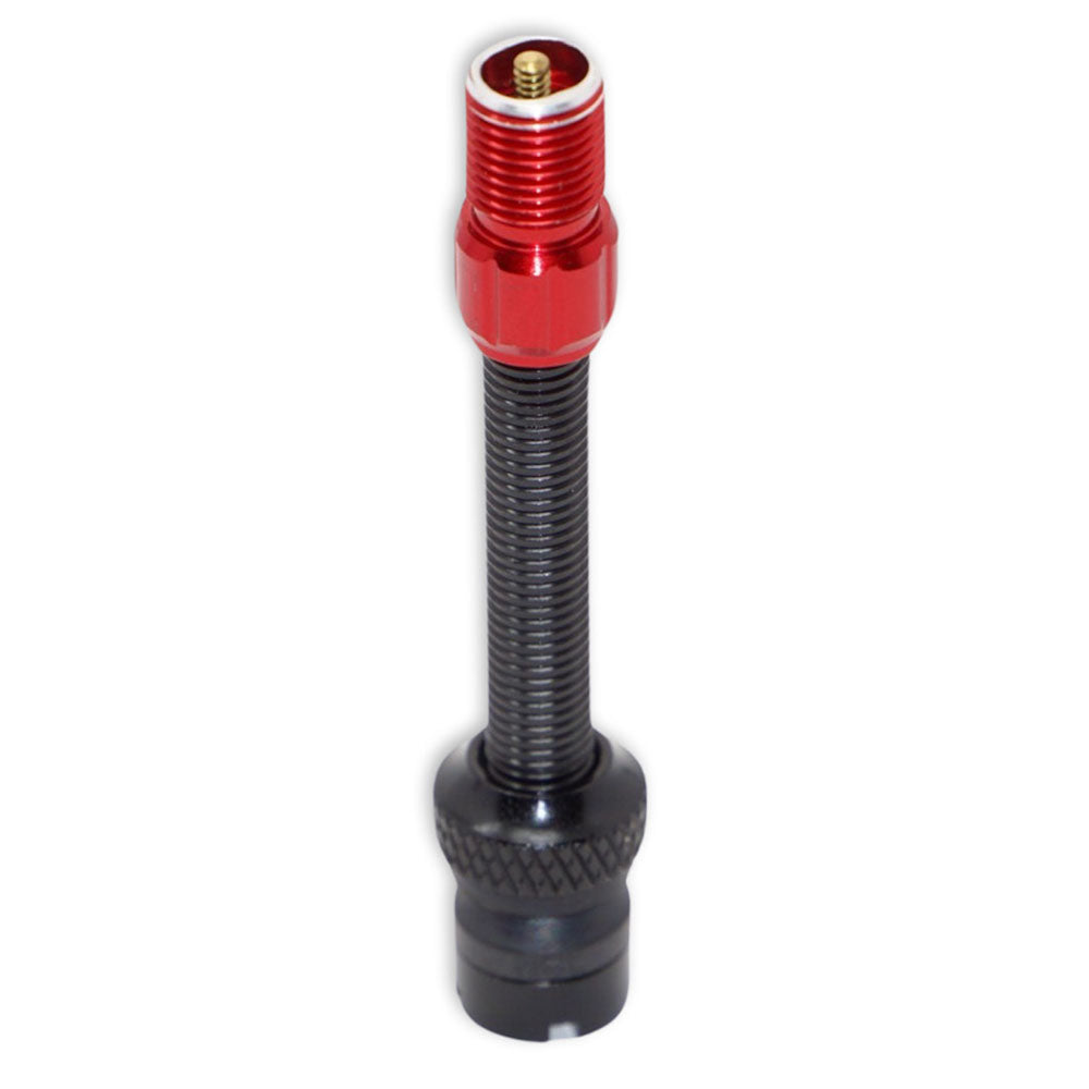 The Prestacycle Prestadapter TUBELESS, a black presta adapter and valve core remover with a threaded body and red metal cap, features lightweight alloy construction and stands upright on a white background.