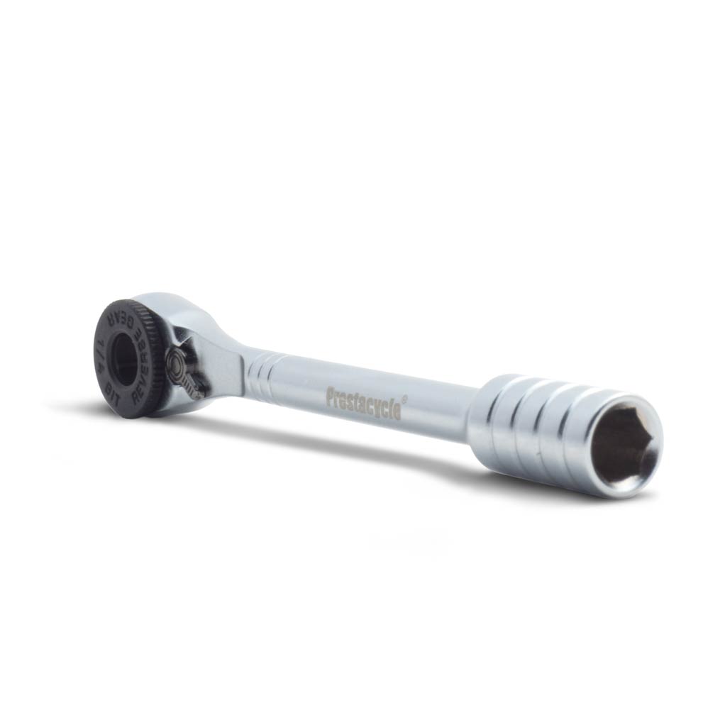 The Prestacycle Prestaratchet Micro kit, featuring a round black ratcheting head, textured handle, six S2 bits, and a round holder stand, is shown on a white background.