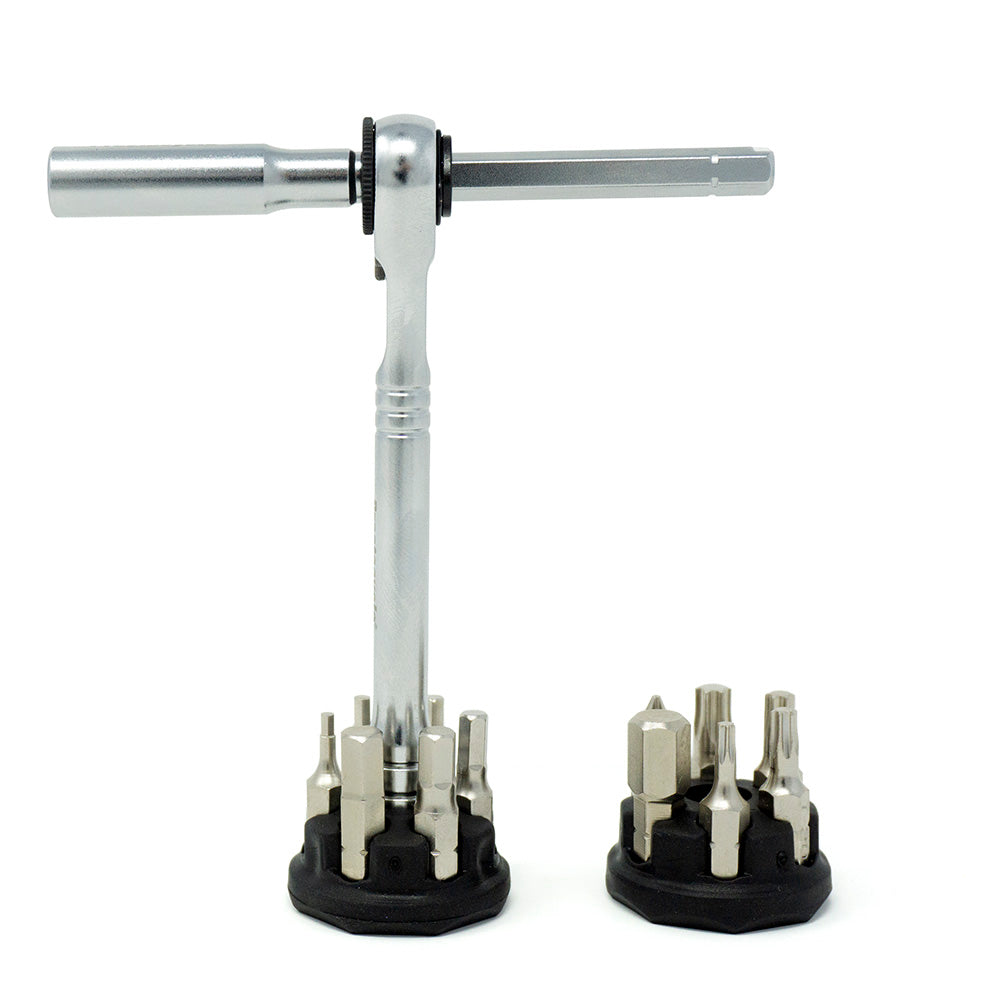 The Prestacycle Pro T-Handle Kit by Prestacycle features a silver ratchet tool standing upright with two black holders of 1/4 inch bits, all neatly arranged on a white background—perfect for precision desktop tasks.