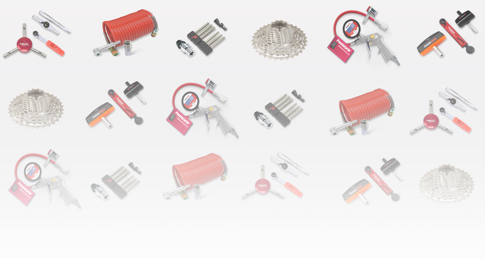 Collection of bicycle repair tools and parts on a white background