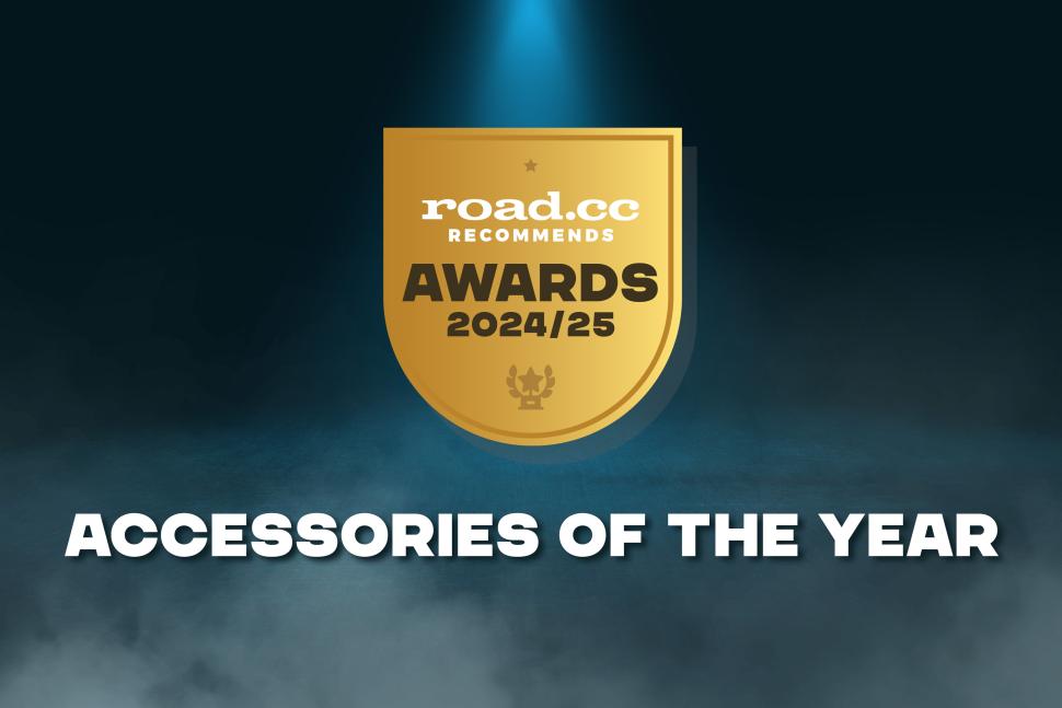 A gold shield-shaped badge reads road.cc Recommends Awards 2024/25 above a trophy icon. Below, bold white text says ACCESSORIES OF THE YEAR, featuring essentials like the Prestacycle Pro T-Handle Kit by Prestacycle on a dark, smoky background.