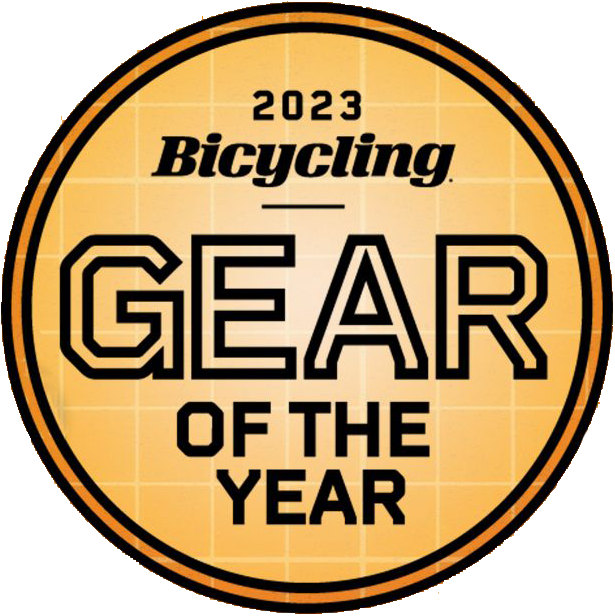 A circular badge with a yellow grid background reads 2023 Bicycling Gear of the Year in bold black letters—perfect for innovative tools like the Prestacycle Prestaratchet GO 5-in-1 Multi-tool Kit.