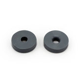 Two round, flat, dark gray Prestacycle Prestaflator Mini Presta Head Gasket washers with central holes are shown side by side on a white background.