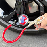 A close-up shows a Prestacycle Prestaflator Digital Bicycle Tire Inflator with red hose attached to a car tire valve, displaying 47.9 PSI, while a person presses the lever—compatible with Presta and Schrader valves and tubeless-safe.