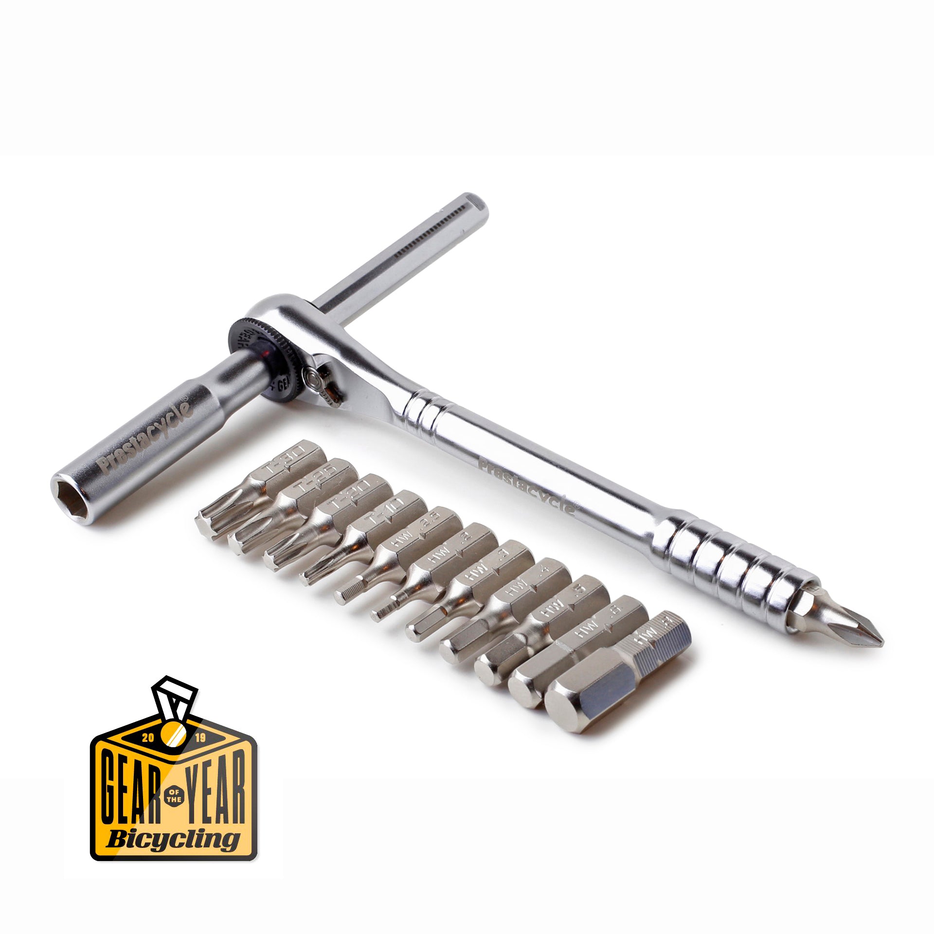 The Prestacycle T-Handle Ratchet Deluxe, a silver multi-tool with interchangeable bits and a T-shaped handle, is shown. A Gear of the Year Bicycling award badge appears in the bottom left corner.
