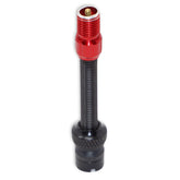 The Prestacycle Prestadapter TUBELESS, a black presta adapter and valve core remover with a threaded body and red metal cap, features lightweight alloy construction and stands upright on a white background.