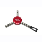 The Prestacycle Mini Pry Bar Specialty Bit, part of the Prestacycle accessory line, features a red circular center, three metal arms including a black adapter, and offers portable functionality. Displayed on a white background.