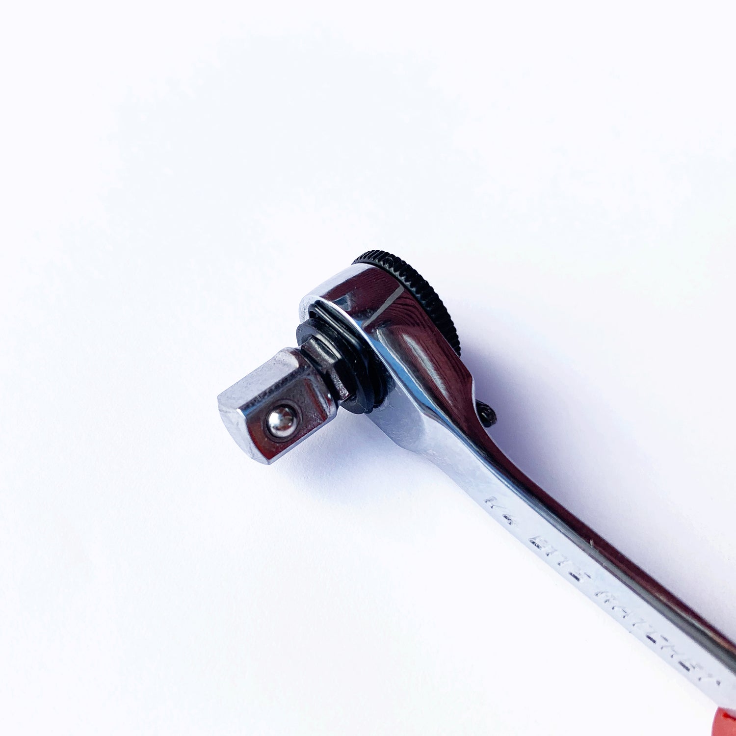 A close-up of the Prestacycle Professional Low-Profile 1/4 Hex to 1/4 Square Socket Adapter by Prestacycle, a shiny metal tool compatible with 1/4″ hex bits, shown on a white background.
