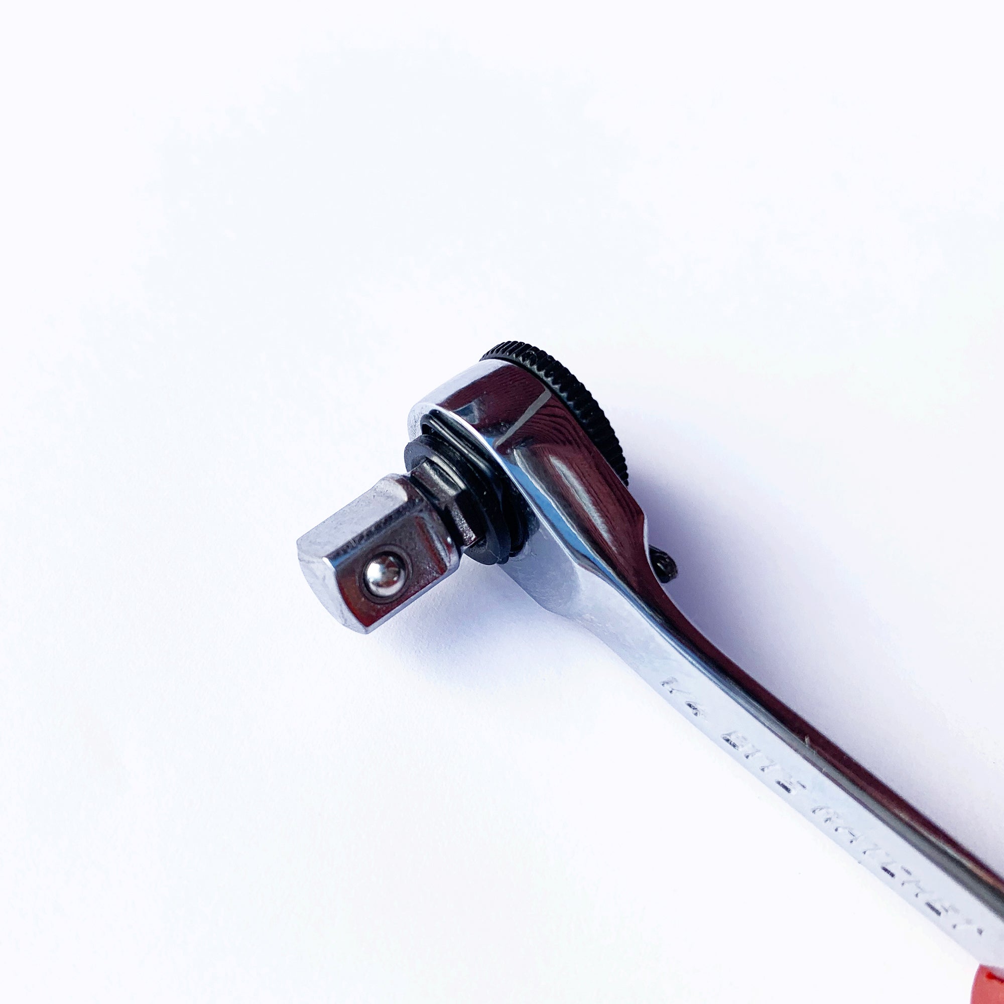 A close-up of the Prestacycle Professional Low-Profile 1/4 Hex to 1/4 Square Socket Adapter by Prestacycle, a shiny metal tool compatible with 1/4″ hex bits, shown on a white background.
