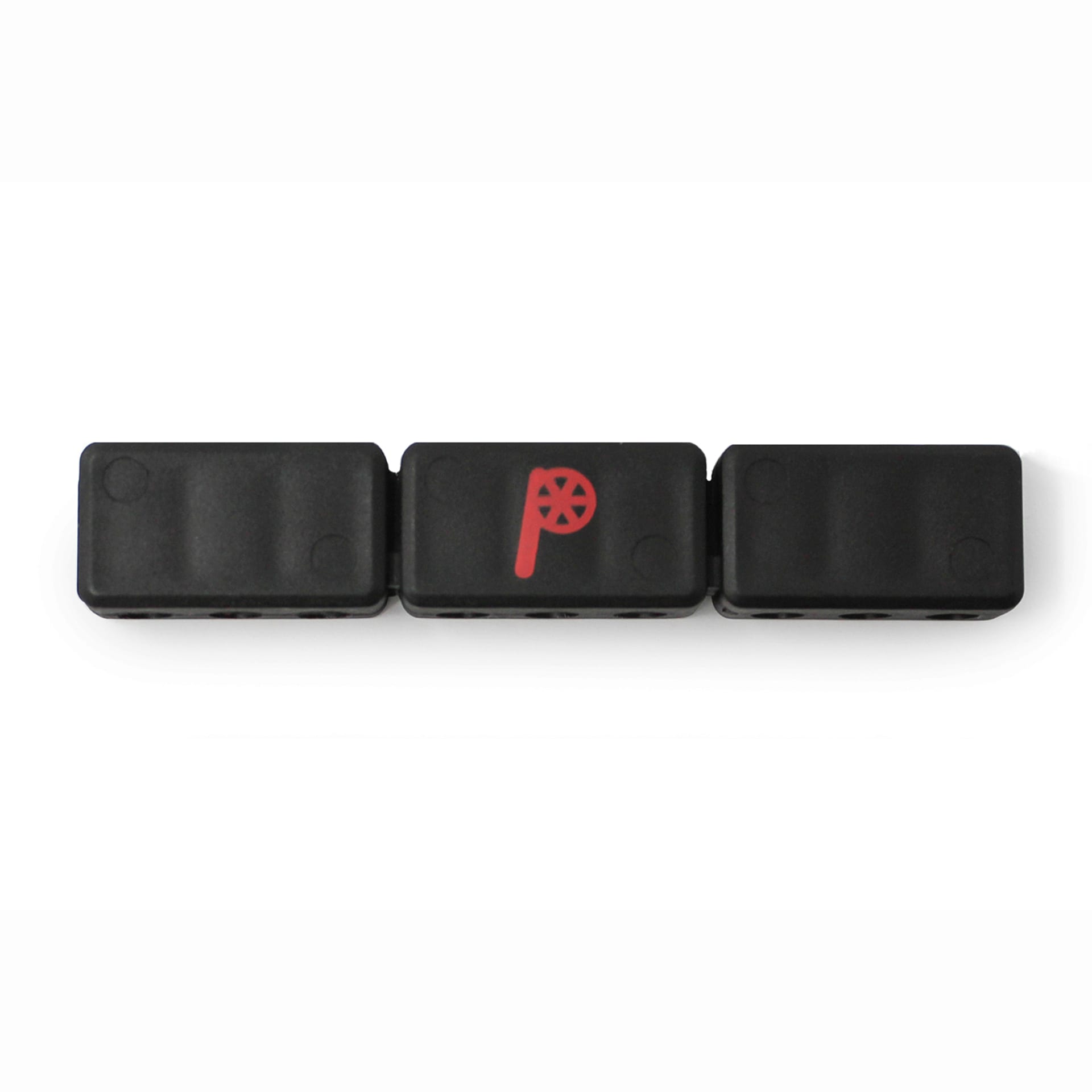 Three black rectangular blocks are arranged in a row. The middle block, the Prestacycle 9 Bits Holder by Prestacycle, displays a red P with a wheel design. All three sit against a white background.