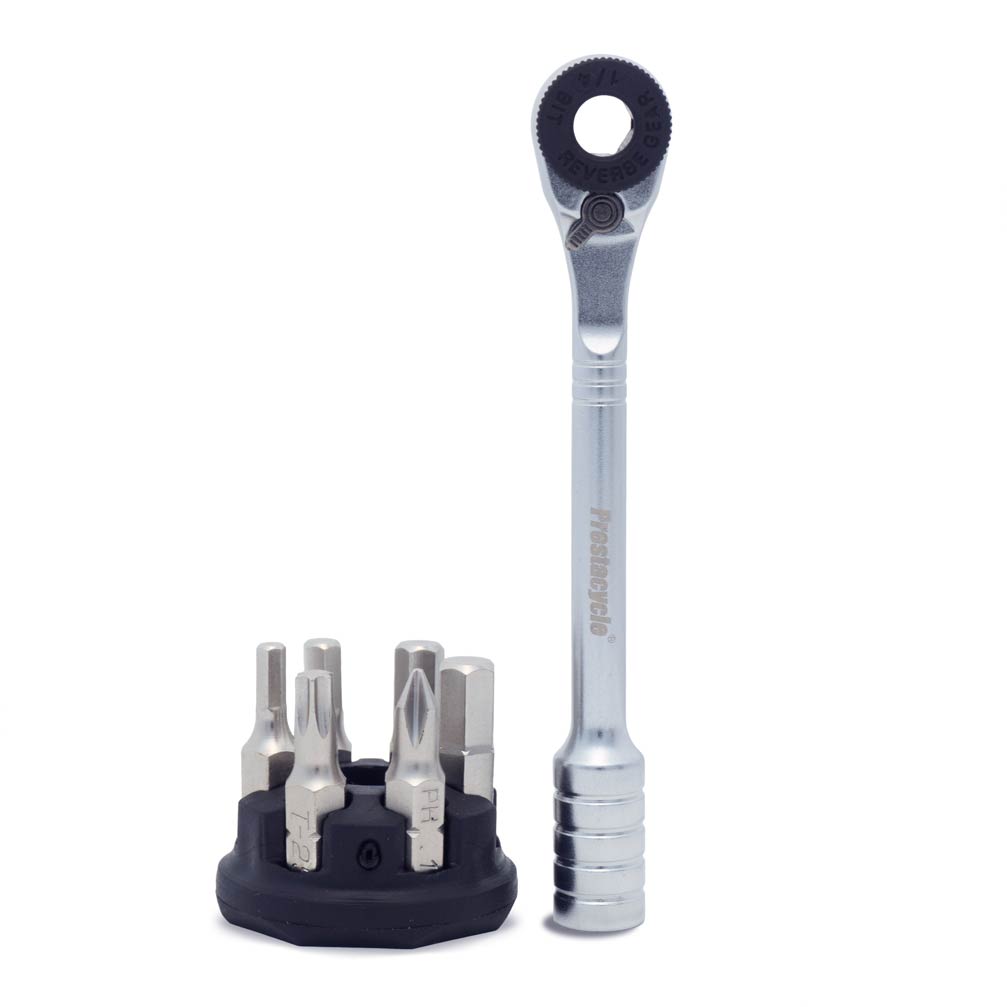 The Prestacycle Prestaratchet Micro Kit features a compact ratchet wrench with a silver handle, plus six S2 bits in a round black holder—perfect as a pocket-sized multi-tool for quick, on-the-go repairs.