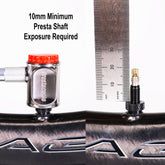 A Prestacycle Pro Presta Head is attached to a Presta valve shown next to a ruler with at least 10mm shaft exposed. Text: Minimum 10mm Presta shaft exposure needed for Prestacycle Pro Presta Head.
