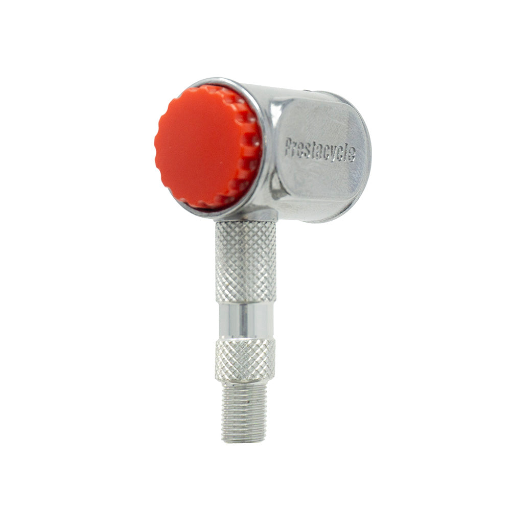 The Prestacycle Pro Presta Head by Prestacycle is a silver metal bicycle tire inflator with a textured grip, knurled adjustment section, auto-lock mechanism, and a red plastic cap, shown against a white background.