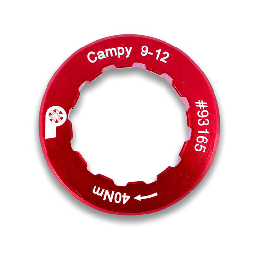 The Prestacycle Campagnolo 9-12 Lockring is a lightweight, red alloy tool with a circular, notched inner edge, labeled Campy 9-12, 40Nm, #93165, and features a small logo on the left side.