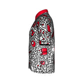 Side view of the Prestacycle Polo from The Kenton Collection, a short-sleeved cycling shirt by Prestacycle featuring a bold black and white abstract pattern with red accents and a solid red collar on performance wicking fabric.