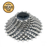 A close-up of the Prestacycle UniBlock PRO Cassette (12 Speed) by Prestacycle, featuring multiple ChroMoly steel gears and a 2023 Bicycling Gear of the Year badge in the top left corner, set against a plain white background.